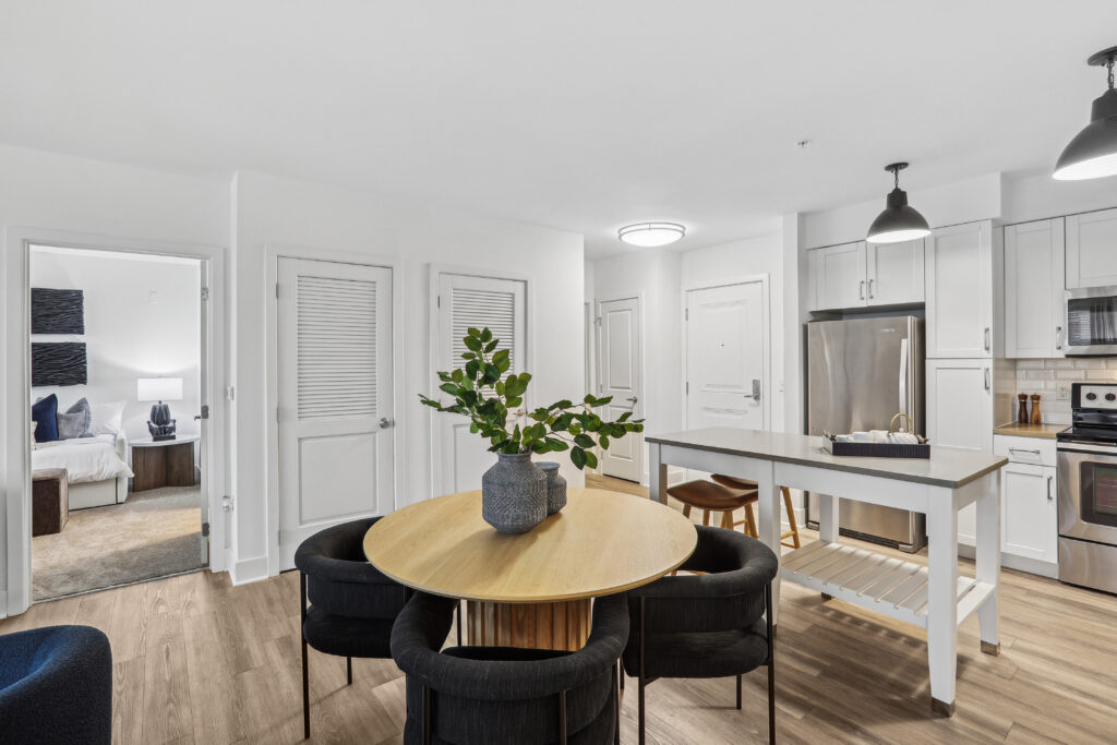 Open concept kitchen and dining area with table and island