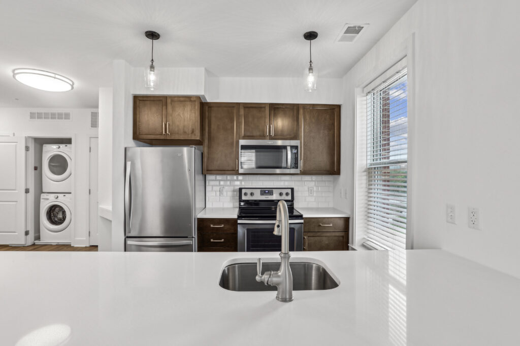 Kitchen with stainless steel appliances and large window